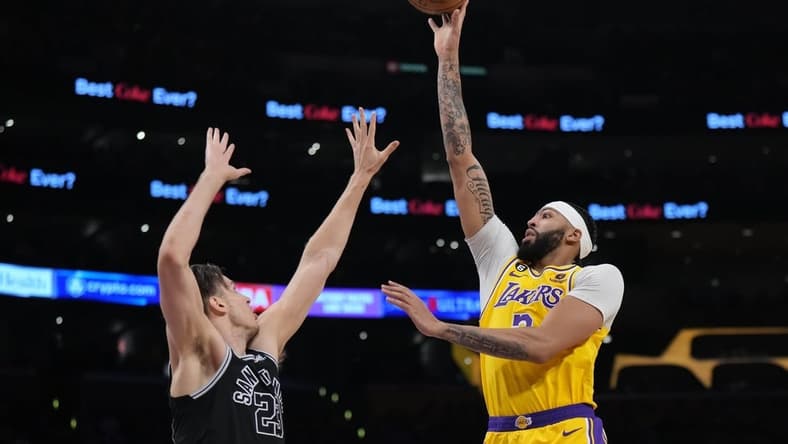 Jan 25, 2023; Los Angeles, California, USA; Los Angeles Lakers forward Anthony Davis (3) shoots the ball over San Antonio Spurs forward Zach Collins (23) in the second half at Crypto.com Arena. Mandatory Credit: Kirby Lee-USA TODAY Sports
