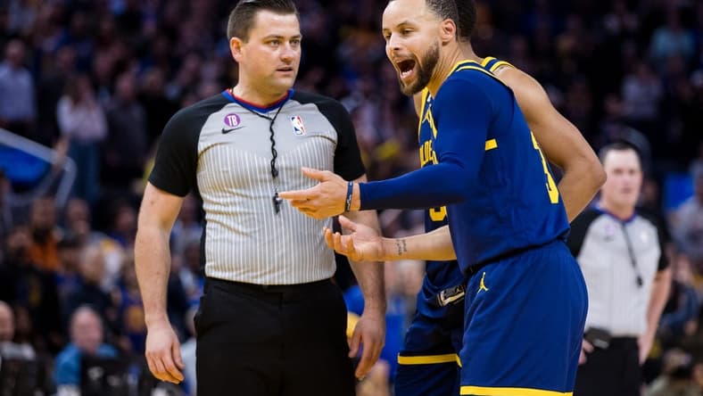 Jan 25, 2023; San Francisco, California, USA; Golden State Warriors guard Stephen Curry (30) argues with official Matt Boland after being ejected for throwing his mouth guard during the second half against the Memphis Grizzlies at Chase Center. Mandatory Credit: John Hefti-USA TODAY Sports