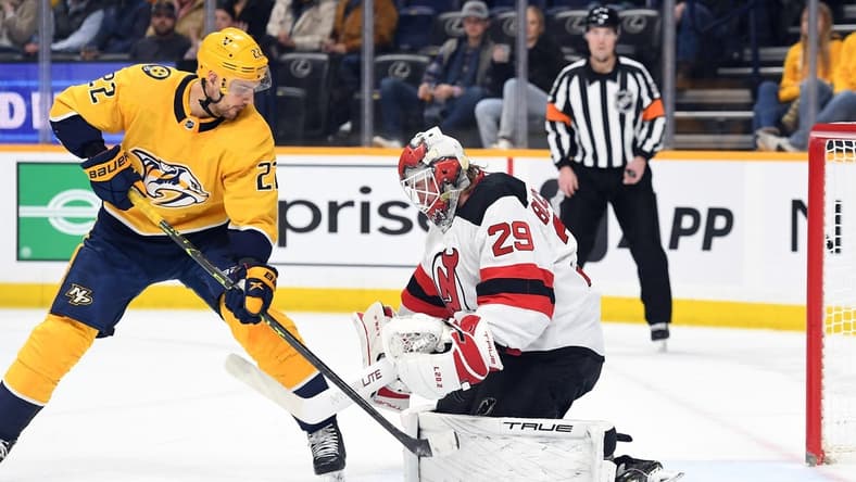 Jan 26, 2023; Nashville, Tennessee, USA; Nashville Predators right wing Nino Niederreiter (22) has a shot blocked by New Jersey Devils goaltender Mackenzie Blackwood (29) during the first period at Bridgestone Arena. Mandatory Credit: Christopher Hanewinckel-USA TODAY Sports