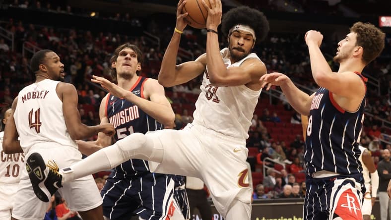 Jan 26, 2023; Houston, Texas, USA; Cleveland Cavaliers center Jarrett Allen (31) grabs a defensive rebound against Houston Rockets center Alperen Sengun (28) in the second quarter at Toyota Center. Mandatory Credit: Thomas Shea-USA TODAY Sports