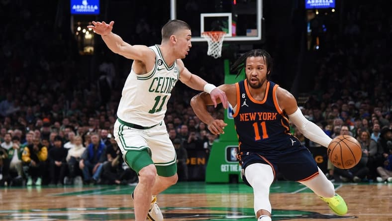 Jan 26, 2023; Boston, Massachusetts, USA; New York Knicks guard Jalen Brunson (11) controls the ball while Boston Celtics guard Payton Pritchard (11) defends during the second half at TD Garden. Mandatory Credit: Bob DeChiara-USA TODAY Sports