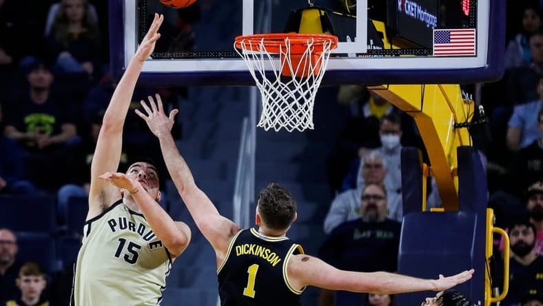 Purdue center Zach Edey (15) goes to the basket against Michigan center Hunter Dickinson (1) during the first half at Crisler Center in Ann Arbor on Thursday, Jan. 26, 2023.