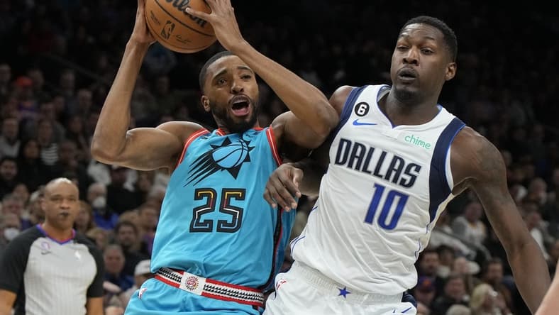 Jan 26, 2023; Phoenix, Arizona, USA; Phoenix Suns forward Mikal Bridges (25) drives on Dallas Mavericks forward Dorian Finney-Smith (10) in the first half at Footprint Center. Mandatory Credit: Rick Scuteri-USA TODAY Sports