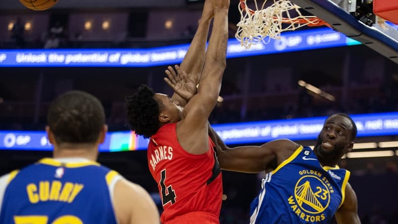 Jan 27, 2023; San Francisco, California, USA; Golden State Warriors forward Draymond Green (23) rejects a shot by Toronto Raptors forward Scottie Barnes (4) during the first quarter at Chase Center. Mandatory Credit: D. Ross Cameron-USA TODAY Sports