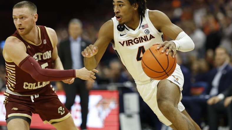Jan 28, 2023; Charlottesville, Virginia, USA; Virginia Cavaliers guard Armaan Franklin (4) drives to the basket as Boston College Eagles guard Mason Madsen (45) defends in the second half at John Paul Jones Arena. Mandatory Credit: Geoff Burke-USA TODAY Sports