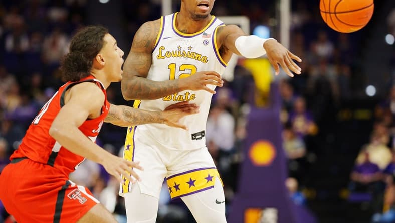 Jan 28, 2023; Baton Rouge, Louisiana, USA; LSU Tigers forward KJ Williams (12) passes the ball against the Texas Tech Red Raiders during the first half at Pete Maravich Assembly Center. Mandatory Credit: Andrew Wevers-USA TODAY Sports
