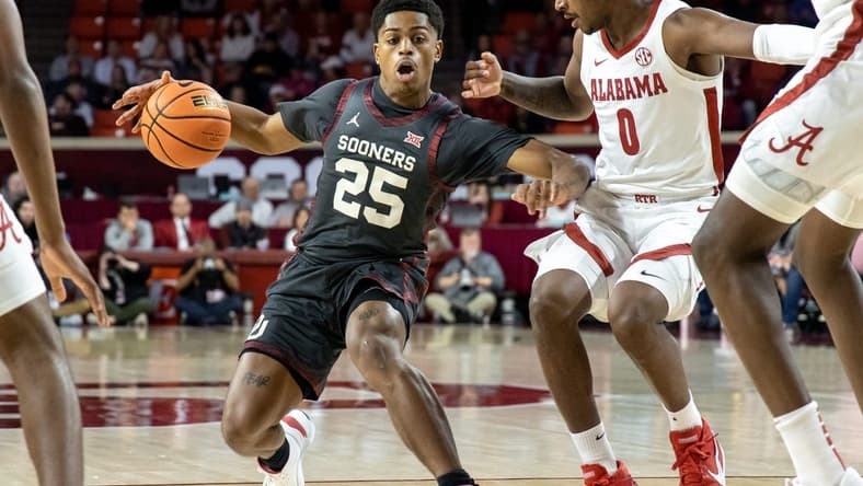 Oklahoma guard Grant Sherfield (25) stops to shoot as Alabama guard Jaden Bradley (0) defends in the first half during a basketball game between The Oklahoma Sooners (OU) and The Alabama Crimson Tide at the Lloyd Noble Center in Norman, Okla., Saturday, Jan. 28, 2023.
Ou Vs Alabama
