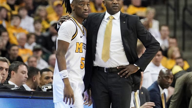 Jan 28, 2023; Columbia, Missouri, USA; Missouri Tigers guard Sean East II (55) and head coach Dennis Gates look on during the second half against the Iowa State Cyclones at Mizzou Arena. Mandatory Credit: Denny Medley-USA TODAY Sports