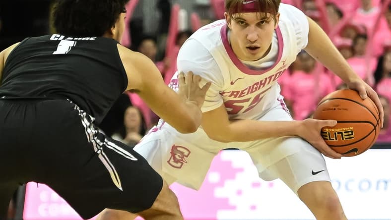 Jan 28, 2023; Omaha, Nebraska, USA; Creighton Bluejays guard Baylor Scheierman (55) looks to drive against Xavier Musketeers guard Desmond Claude (1) in the second half at CHI Health Center Omaha. Mandatory Credit: Steven Branscombe-USA TODAY Sports