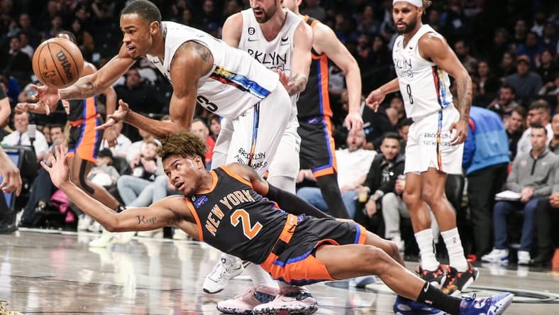 Jan 28, 2023; Brooklyn, New York, USA; Brooklyn Nets center Nic Claxton (33) and New York Knicks guard Miles McBride (2) fight for a loose ball in the second quarter at Barclays Center. Mandatory Credit: Wendell Cruz-USA TODAY Sports