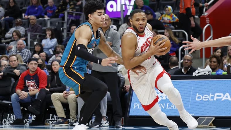 Jan 28, 2023; Detroit, Michigan, USA; Houston Rockets guard Eric Gordon (10) dribbles on Detroit Pistons guard Killian Hayes (7) in the first half at Little Caesars Arena. Mandatory Credit: Rick Osentoski-USA TODAY Sports