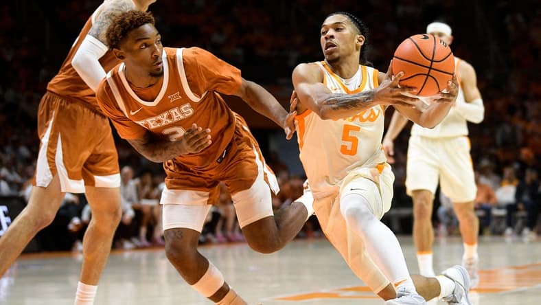 Tennessee guard Zakai Zeigler (5) dribbles as Texas guard Artery Morris (2) defends during a game between Tennessee and Texas at Thompson-Boling Arena in Knoxville, Tenn., on Saturday, Jan. 28, 2023.
Kns Ut Basketball Vs Texas