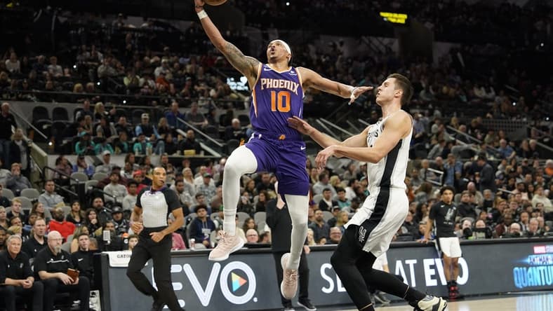 Jan 28, 2023; San Antonio, Texas, USA; Phoenix Suns guard Damion Lee (10) lays in a basket while defended by San Antonio Spurs forward Zach Collins (23) during the first half at AT&T Center. Mandatory Credit: Scott Wachter-USA TODAY Sports