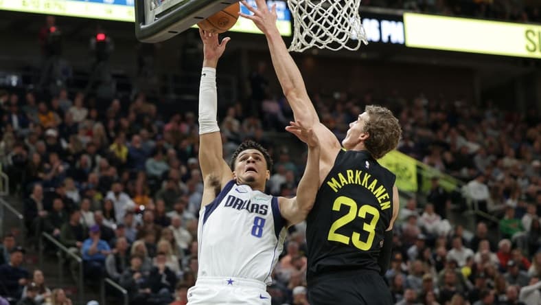 Jan 28, 2023; Salt Lake City, Utah, USA; Utah Jazz forward Lauri Markkanen (23) blocks the shot of Dallas Mavericks guard Josh Green (8) during the second quarter at Vivint Arena. Mandatory Credit: Chris Nicoll-USA TODAY Sports
