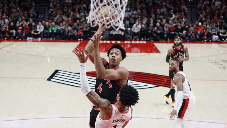 Jan 28, 2023; Portland, Oregon, USA; Toronto Raptors small forward Scottie Barnes (4) shoots the ball against Portland Trail Blazers shooting guard Anfernee Simons (1) during the first half at Moda Center. Mandatory Credit: Soobum Im-USA TODAY Sports