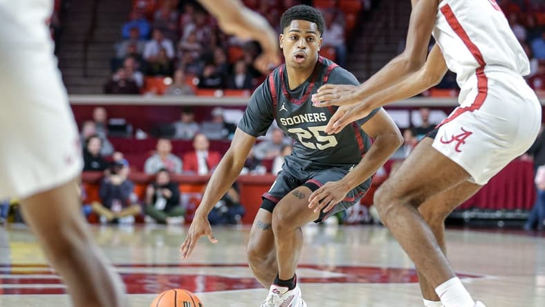 Oklahoma guard Grant Sherfield (25) looks to pass in the first half during a basketball game between The Oklahoma Sooners (OU) and The Alabama Crimson Tide at the Lloyd Noble Center in Norman, Okla., Saturday, Jan. 28, 2023.
cover small