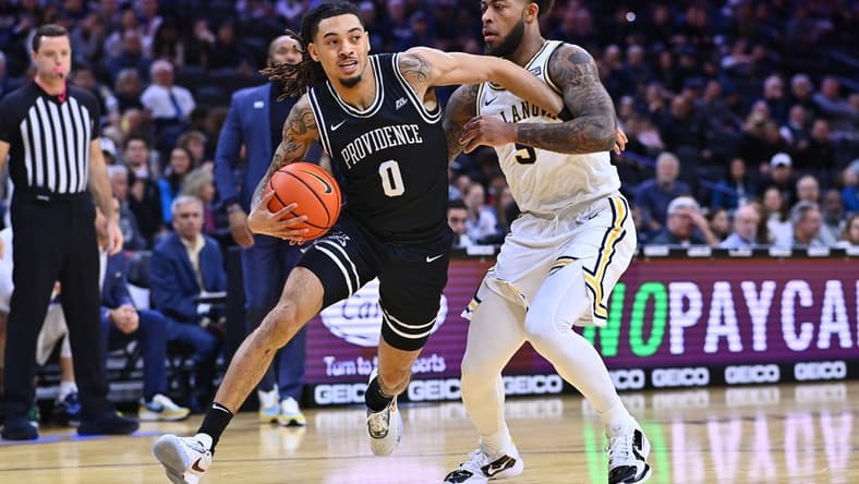 Jan 29, 2023; Philadelphia, Pennsylvania, USA; Providence Friars guard Alyn Breed (0) drives against Villanova Wildcats guard Justin Moore (5) in the first half at Wells Fargo Center. Mandatory Credit: Kyle Ross-USA TODAY Sports
