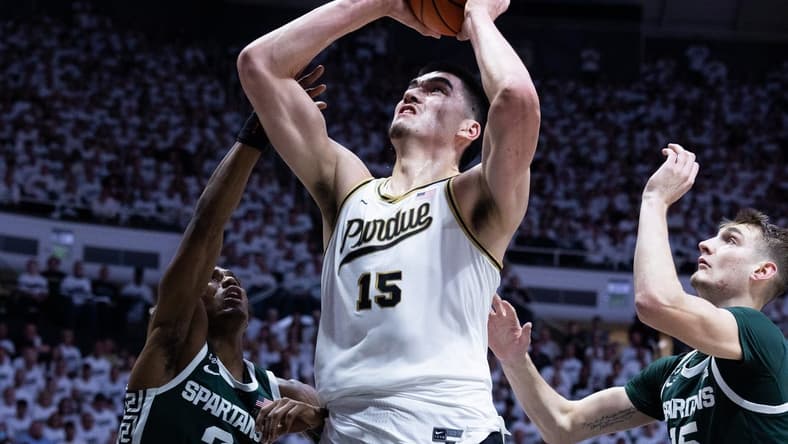 Jan 29, 2023; West Lafayette, Indiana, USA; Purdue Boilermakers center Zach Edey (15) shoots the ball while Michigan State Spartans guard Tyson Walker (2) and center Carson Cooper (15) defend in the second half at Mackey Arena. Mandatory Credit: Trevor Ruszkowski-USA TODAY Sports