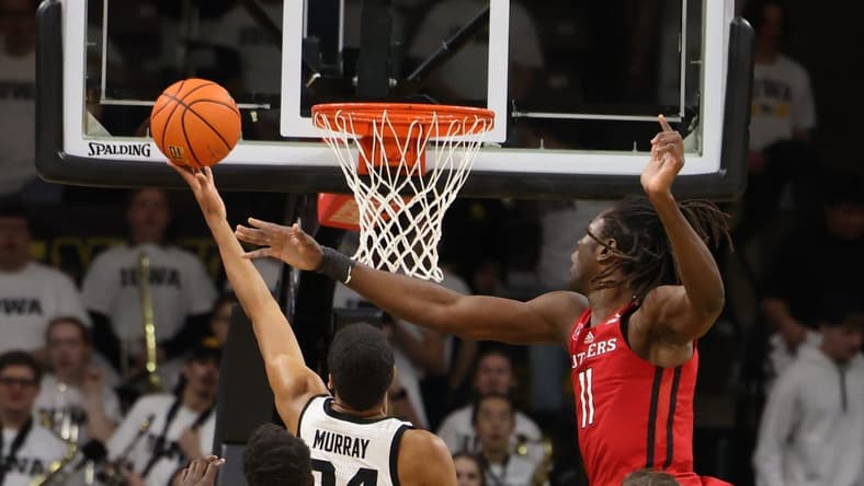 Jan 29, 2023; Iowa City, Iowa, USA; Rutgers Scarlet Knights center Clifford Omoruyi (11) defends the shot from Iowa Hawkeyes forward Kris Murray (24) during the first half at Carver-Hawkeye Arena. Mandatory Credit: Reese Strickland-USA TODAY Sports