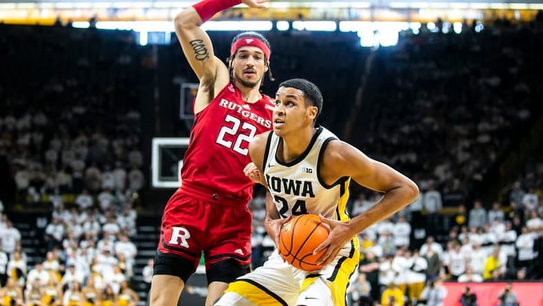Iowa forward Kris Murray, right, drives to the basket as Rutgers guard Caleb McConnell defends during a NCAA Big Ten Conference men's basketball game, Sunday, Jan. 29, 2023, at Carver-Hawkeye Arena in Iowa City, Iowa.
230129 Rutgers Iowa Mbb 051 Jpg
