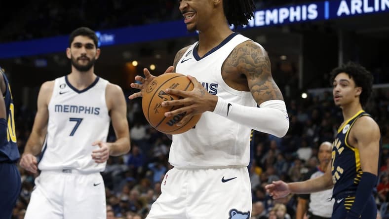 Jan 29, 2023; Memphis, Tennessee, USA; Memphis Grizzlies guard Ja Morant (12) reacts during the second half against the Indiana Pacers at FedExForum. Mandatory Credit: Petre Thomas-USA TODAY Sports