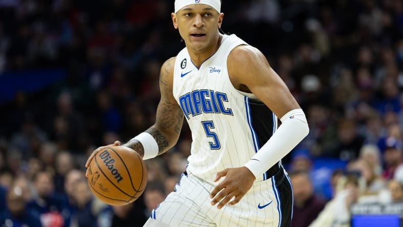 Jan 30, 2023; Philadelphia, Pennsylvania, USA; Orlando Magic forward Paolo Banchero (5) dribbles the ball against the Philadelphia 76ers during the first quarter at Wells Fargo Center. Mandatory Credit: Bill Streicher-USA TODAY Sports