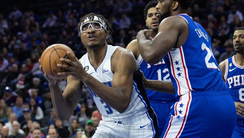 Jan 30, 2023; Philadelphia, Pennsylvania, USA; Orlando Magic center Wendell Carter Jr. (34) controls the ball in front of Philadelphia 76ers center Joel Embiid (21) during the first quarter at Wells Fargo Center. Mandatory Credit: Bill Streicher-USA TODAY Sports