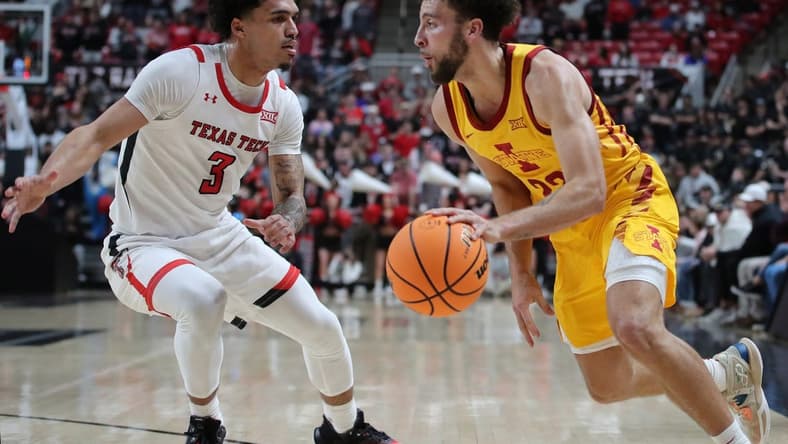 Jan 30, 2023; Lubbock, Texas, USA;  Iowa State Cyclones guard Gabe Klscheur (22) drives to the lane against Texas Tech Red Raiders guard D   Maurian Williams (3) in the first half at United Supermarkets Arena. Mandatory Credit: Michael C. Johnson-USA TODAY Sports