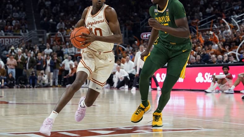 Jan 30, 2023; Austin, Texas, USA; Texas Longhorns guard Sir'Jabari Rice (10) drives to the basket against Baylor Bears forward Josh Ojianwuna (15) during the first half at Moody Center. Mandatory Credit: Scott Wachter-USA TODAY Sports