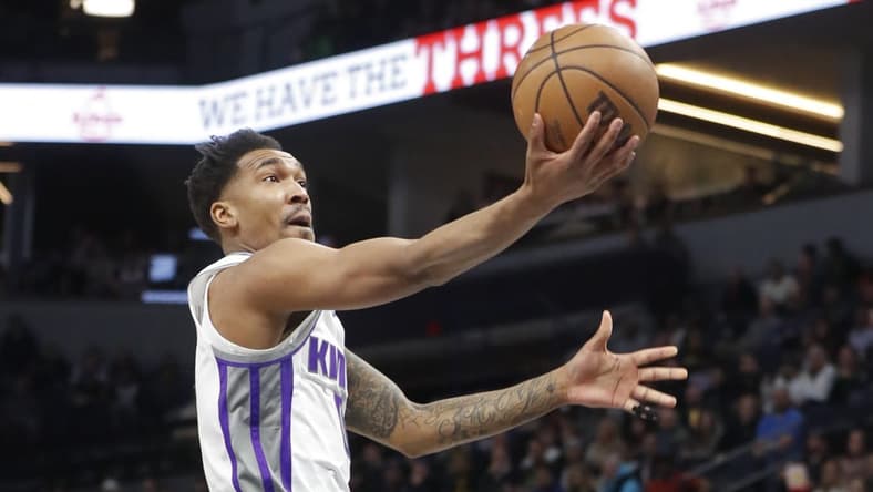 Jan 30, 2023; Minneapolis, Minnesota, USA; Sacramento Kings guard Malik Monk (0) goes to the basket against the Minnesota Gophers the Minnesota Timberwolves in the first quarter at Target Center. Mandatory Credit: Bruce Kluckhohn-USA TODAY Sports