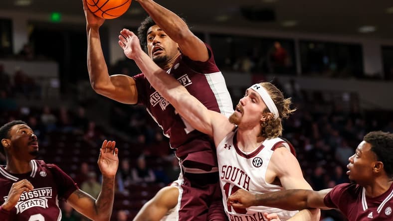 Jan 31, 2023; Columbia, South Carolina, USA; Mississippi State Bulldogs forward Tolu Smith (1) grabs a rebound over South Carolina Gamecocks forward Hayden Brown (10) in the first half at Colonial Life Arena. Mandatory Credit: Jeff Blake-USA TODAY Sports