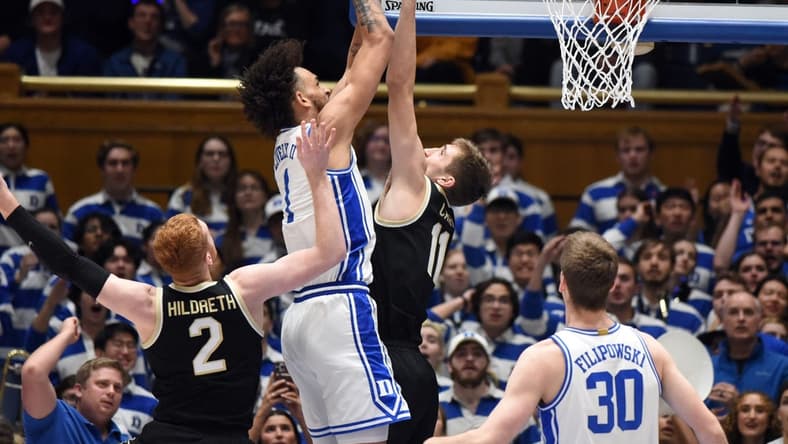 Jan 31, 2023; Durham, North Carolina, USA; Duke Blue Devils center Dereck Lively (1) shoots over Wake Forest Demon Deacons forward Andrew Carr (11) during the first half at Cameron Indoor Stadium. Mandatory Credit: Rob Kinnan-USA TODAY Sports