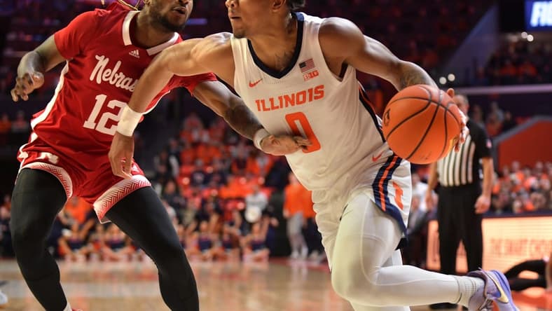 Jan 31, 2023; Champaign, Illinois, USA; Illinois Fighting Illini guard Terrence Shannon Jr. (0) dribbles the ball against Nebraska Cornhuskers guard Denim Dawson (12) during the first half at State Farm Center. Mandatory Credit: Ron Johnson-USA TODAY Sports