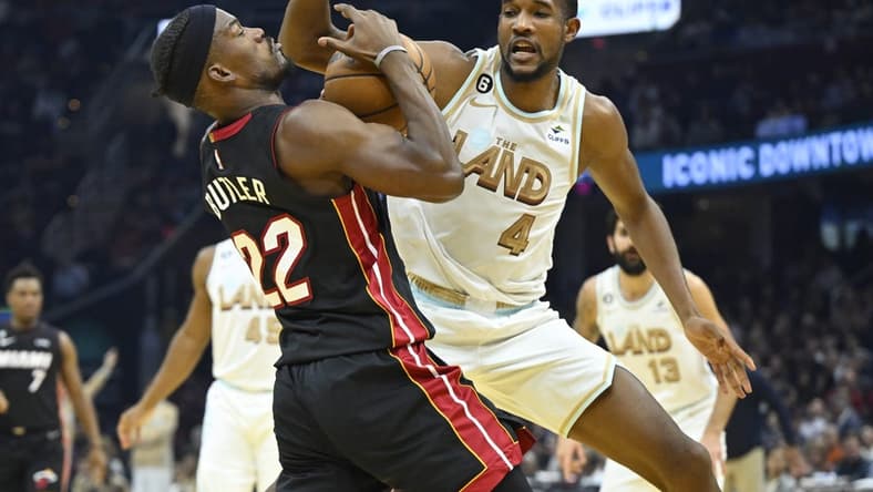 Jan 31, 2023; Cleveland, Ohio, USA; Cleveland Cavaliers forward Evan Mobley (4) defends Miami Heat forward Jimmy Butler (22) in the second quarter at Rocket Mortgage FieldHouse. Mandatory Credit: David Richard-USA TODAY Sports