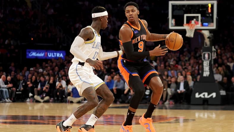 Jan 31, 2023; New York, New York, USA; New York Knicks guard RJ Barrett (9) brings the ball up court against Los Angeles Lakers guard Dennis Schroder (17) during the first quarter at Madison Square Garden. Mandatory Credit: Brad Penner-USA TODAY Sports