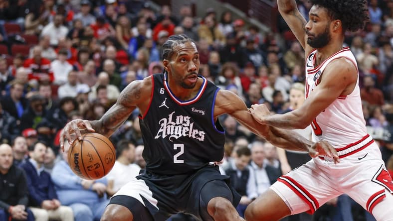 Jan 31, 2023; Chicago, Illinois, USA; LA Clippers forward Kawhi Leonard (2) drives to the basket against Chicago Bulls guard Coby White (0) during the first half at United Center. Mandatory Credit: Kamil Krzaczynski-USA TODAY Sports