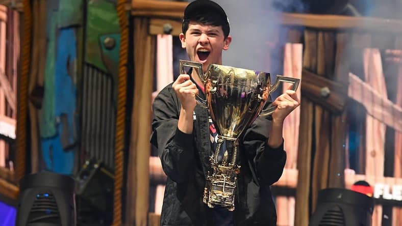 Jul 28, 2019; Flushing, NY, USA; Bugha celebrates his win as the first solo World Champion at the Fortnite World Cup Finals e-sports event at Arthur Ashe Stadium. Mandatory Credit: Dennis Schneidler-USA TODAY Sports