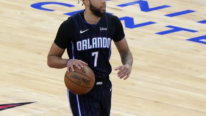 Apr 14, 2021; Chicago, Illinois, USA; Orlando Magic guard Michael Carter-Williams (7) dribbles the ball against the Chicago Bulls during the first quarter at the United Center. Mandatory Credit: Mike Dinovo-USA TODAY Sports
