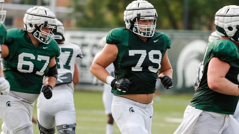 Michigan State offensive tackle Jarrett Horst (79) runs off the field after a drill Wednesday, Aug. 11, 2021 at the team's practice facility in East Lansing.