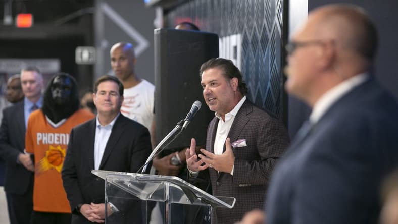 Sep 8, 2021; Phoenix, AZ, USA; Phoenix Suns Suns president and CEO Jason Rowley speaks as Arizona Governor Doug Ducey (left) looks on during the grand opening event at the FanDuel Sportsbook at the Footprint Center in Phoenix on September 8, 2021. David Wallace/The Republic via USA TODAY NETWORK