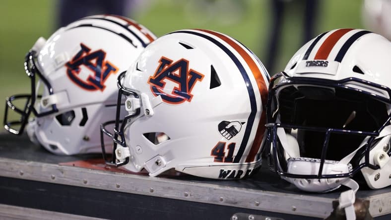 Oct 2, 2021; Baton Rouge, Louisiana, USA; Auburn Tigers helmets sits on a crate during a game against LSU Tigers at Tiger Stadium. Mandatory Credit: Stephen Lew-USA TODAY Sports