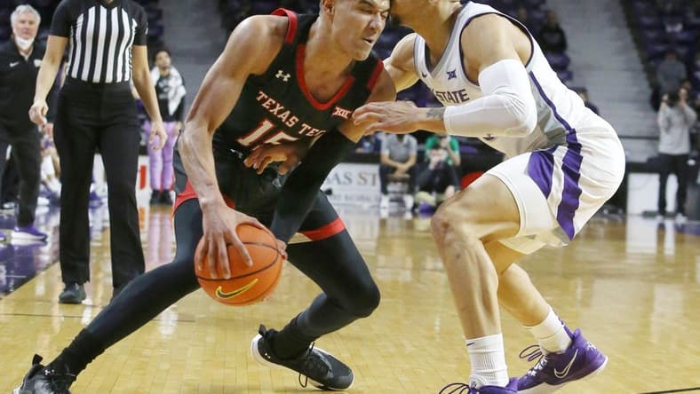 Jan 15, 2022; Manhattan, Kansas, USA;  Texas Tech Red Raiders guard Kevin McCullar (15) is guarded by Kansas State Wildcats guard Mike McGuirl (00) during the second half at Bramlage Coliseum. Mandatory Credit: Scott Sewell-USA TODAY Sports