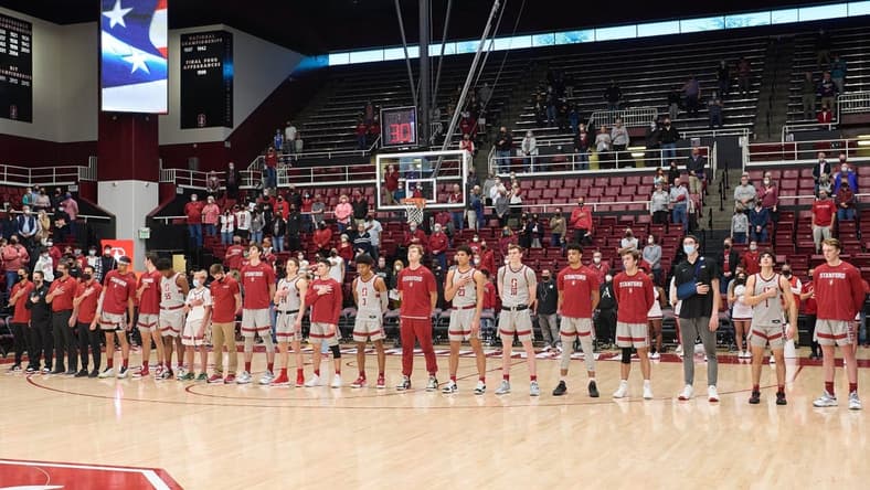 Feb 6, 2022; Stanford, California, USA;  The Stanford Cardinal men's basketball team stands for the national anthem before a game against the Washington Huskies at Maples Pavilion. Mandatory Credit: Robert Edwards-USA TODAY Sports