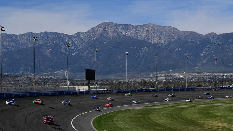 Feb 27, 2022; Fontana, California, USA; General view as NASCAR Cup Series driver Tyler Reddick (8) leads a group during the WISE Power 400 at Auto Club Speedway. Mandatory Credit: Gary A. Vasquez-USA TODAY Sports