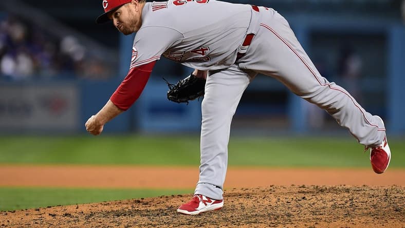 Apr 14, 2022; Los Angeles, California, USA; Cincinnati Reds relief pitcher Justin Wilson (34) throws against the Los Angeles Dodgers during the eighth inning at Dodger Stadium. Mandatory Credit: Gary A. Vasquez-USA TODAY Sports
