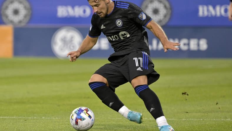 Jun 18, 2022; Montreal, Quebec, CAN; CF Montreal midfielder Matko Miljevic (11) plays the ball during the first half of the game against the Austin FC at Stade Saputo. Mandatory Credit: Eric Bolte-USA TODAY Sports