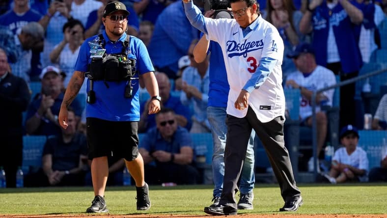 Jul 19, 2022; Los Angeles, California, USA; Los Angeles Dodgers former pitcher Fernando Valenzuela waves to the crowd before throwing a ceremonial first pitch before the 2022 MLB All Star Game at Dodger Stadium. Mandatory Credit: Robert Hanashiro-USA TODAY Sports
