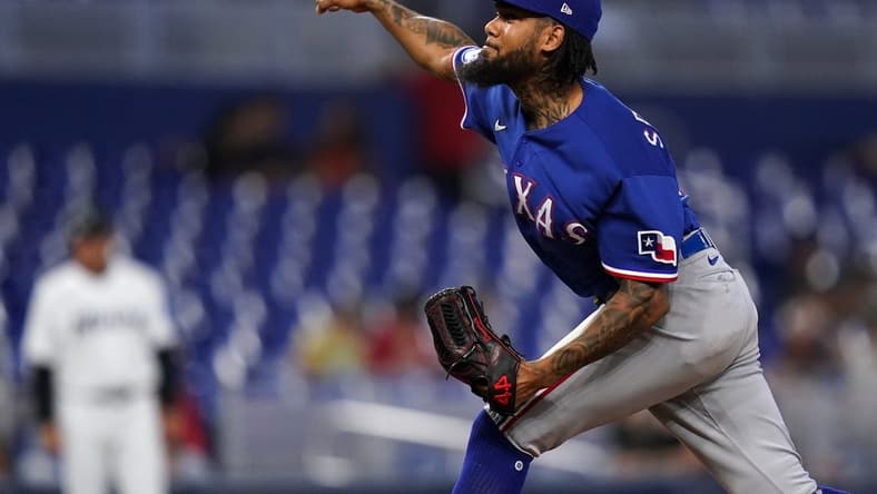 Jul 21, 2022; Miami, Florida, USA; Texas Rangers relief pitcher Dennis Santana (19) delivers a pitch in the ninth inning against the Miami Marlins at loanDepot park. Mandatory Credit: Jasen Vinlove-USA TODAY Sports