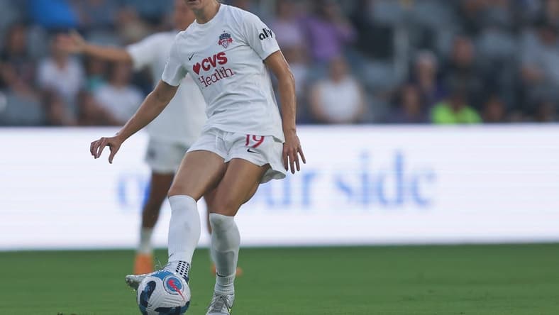 Aug 5, 2022; Louisville, Kentucky, USA;  Washington Spirit midfielder Dorian Bailey (19) passes the ball during the first half against Racing Louisville FC at Lynn Family Stadium. Mandatory Credit: EM Dash-USA TODAY Sports