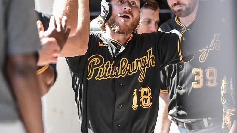 Aug 31, 2022; Milwaukee, Wisconsin, USA; Pittsburgh Pirates right fielder Ben Gamel (18) is greeted in the dugout after hitting a solo home run in the fourth inning against the Milwaukee Brewers at American Family Field. Mandatory Credit: Benny Sieu-USA TODAY Sports